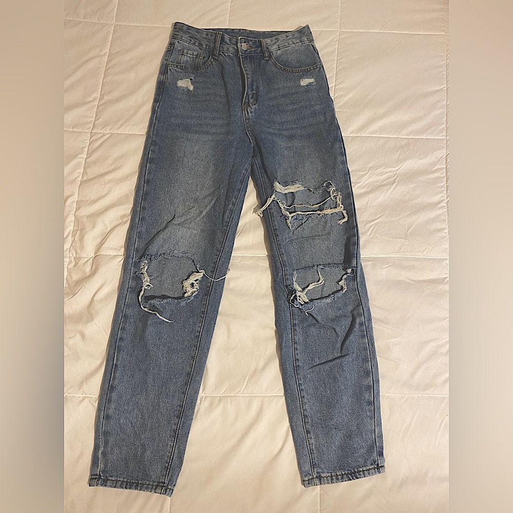 Medium washed distressed ripped jeans